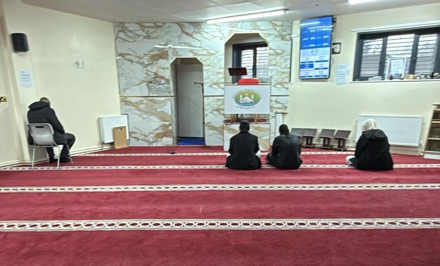 The main prayer hall at Attarbiya Masjid, with the marble wall around the mihrab and minbar